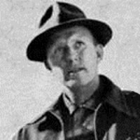 Elbert Warren Old photo of a man in a fedora and work jacket